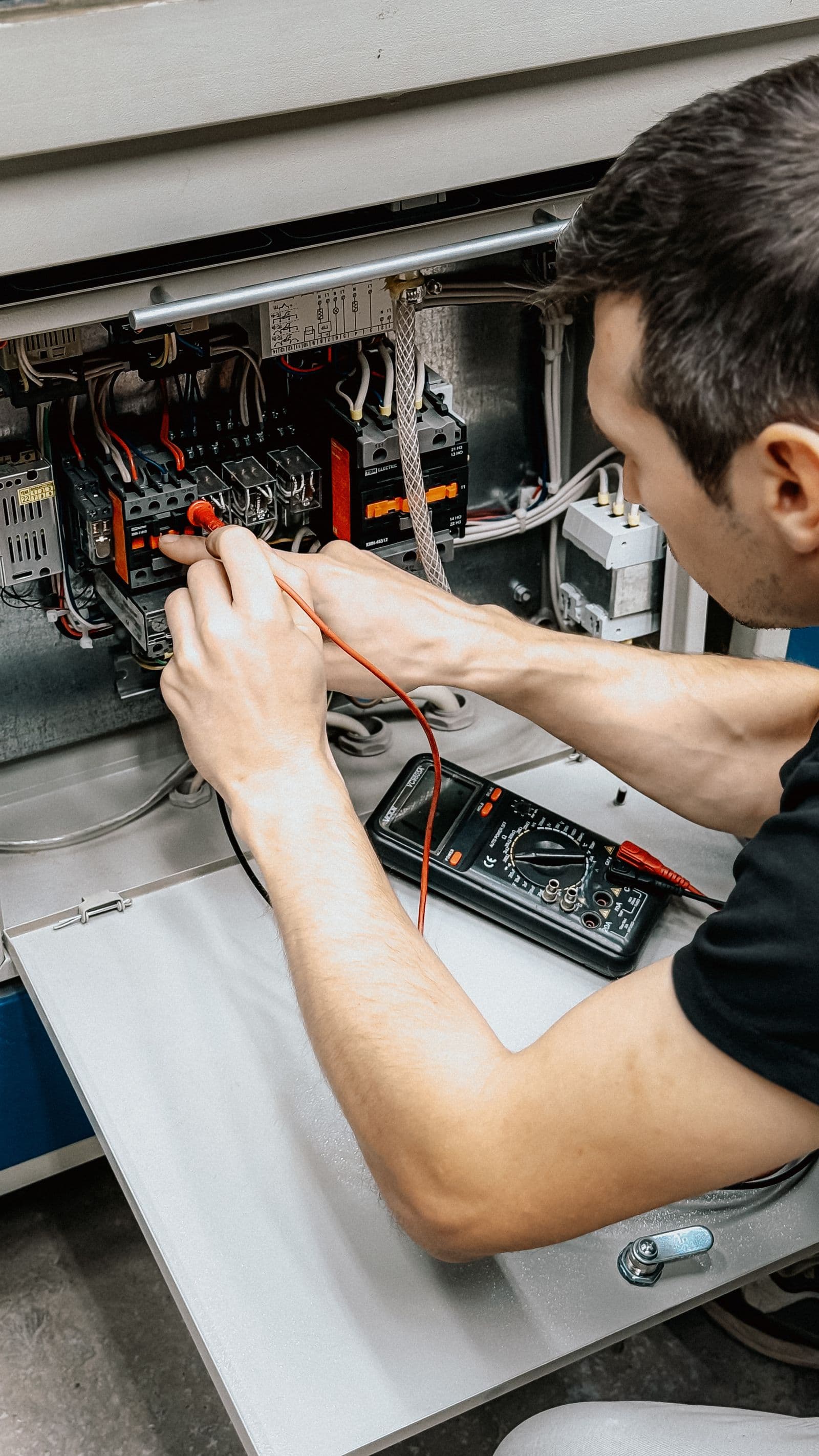 Maintenance technician inspecting electrical systems